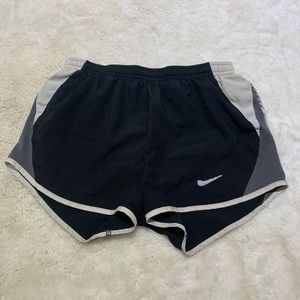 Black Nike shorts with grey and white on sides